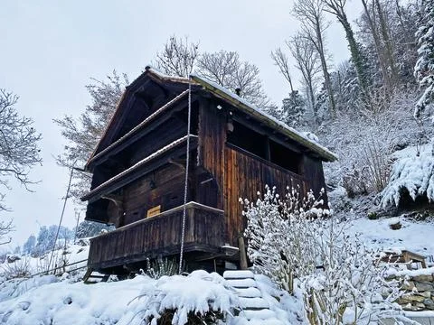 Idyllic Swiss alpine mountain huts and traditional Swiss rural architecture Stock Photos