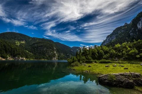 Idyllic view with dramatic clouds on Dachstein Stock Photos