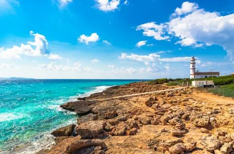 Idyllic view of Lighthouse at Cap de Ses Salines, beautiful seaside Mallorca Stock Photos