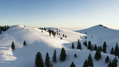 Idyllic Winter View Of Top Of the Hill Covered With Snow and Snowmobile Lines. Stock Footage 168252474