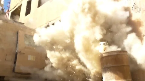 An IED explodes outside a building in Afghanistan. Stock Footage