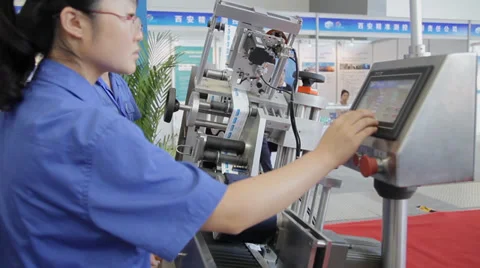 Iew of worker operating machine, Aug 29, 2013, Xi'an city,  china. Stock Footage 38017197