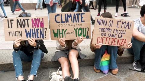 "if not now then when" girls with sign at Friday for future demonstration Milan Видео 266820976