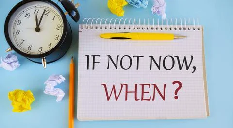 If Not Now When message written in Notebook. Stock Photos