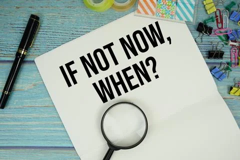 If Not Now, When? text written on notepad with magnifying glass flat lay on.. Stock Photos
