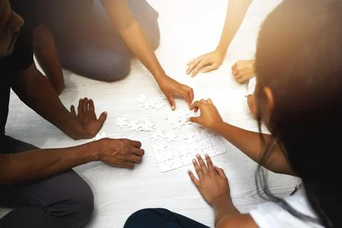 If we work together, we can complete it faster. a group of unrecognizable people Fotos de archivo