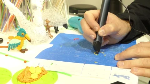IFA, BERLIN - SEPTEMBER 5 2016: Woman creates a model using 3D-pen at IFA Glo Stock Footage 121681717