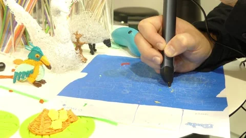 IFA, BERLIN - SEPTEMBER 5 2016: Woman creates a model using 3D-pen at IFA Glo Stock Footage 125590943