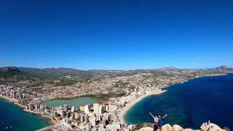 Ifach Penon top View point. People at the top taking pictures of Calpe coast Vídeos de archivo 143010387