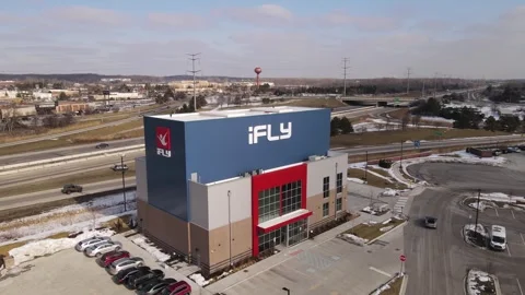 IFly indoor skydiving facility building exterior in Michigan, aerial drone Vidéo 244918745