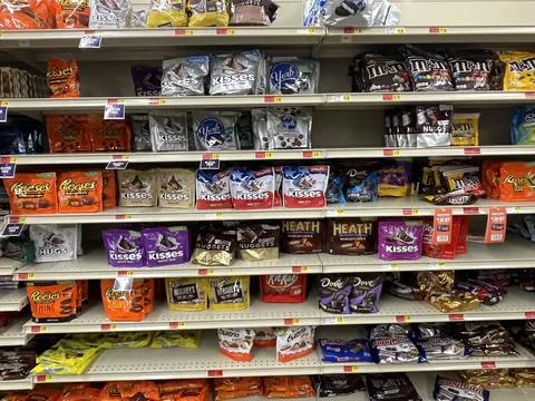 IGA grocery store candy section and prices front facing Stock Photos