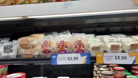 IGA retail grocery store ceiling pan of dirty shelves in the deli cold case s Stock Footage 158458943