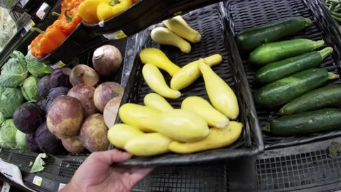 IGA retail grocery store interior dirty under a  a basket of squash in produc Stock Footage 158320289