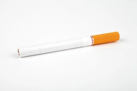 ?igarette with an orange filter on a white background, close-up, place for te Stock Photos