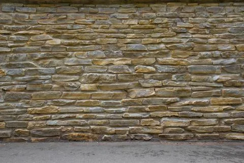 Ight brown brick wall background with irregular pattern texture background. Stock Photos