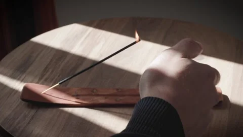 Ighting an Incense Stick in a Minimalist Setting Stock Footage 302465225
