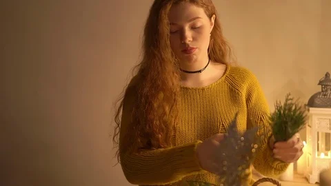 A igirl making christmas wreath on table Stock Footage 75940886