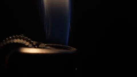 Ignite cigarette lighter black background 4k Stock Footage 104861254