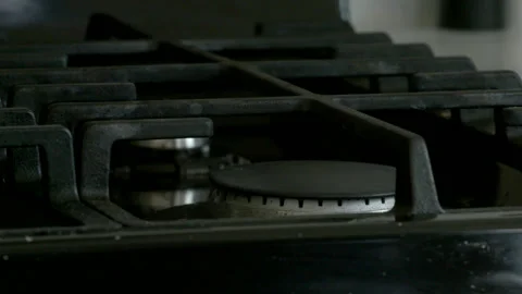 Igniting and Heating Pot on Gas Stove Burner Stock Footage 343093945