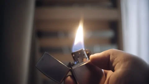 Igniting and talking gasoline lighter close up 스톡 동영상 153117520