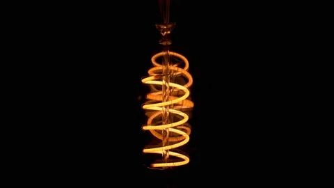 An igniting bulb in dark Vídeo Stock 196856980