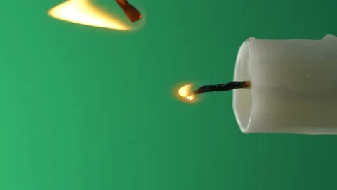 Igniting candle light flame with match on green screen background, vertical shot Stock Footage 143758306