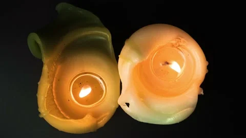 Igniting candles top view on black background. Candles burn and than light out  Video stock 170499110