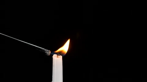 Igniting fire onto candle with lighter Stock-Footage 158907177