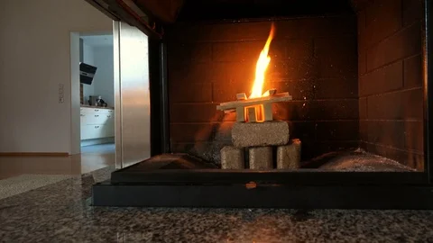 Igniting fire in fireplace at modern home Video stock 82217904