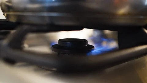 Igniting a flame on a gas stovetop in slow motion Stock Footage 108560532