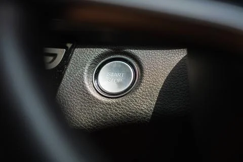 Igniting future start-stop button activation in modern vehicles close-up pe.. Stock Photos