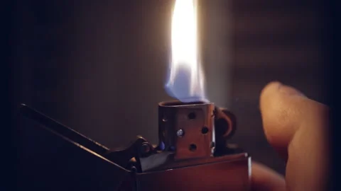 Igniting a gasoline lighter close-up Stock Footage 153116694