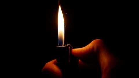 Igniting a lighter in dark (40% slow motion) Stock-Footage 100519443