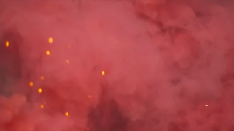Igniting Red Smoke Grenade with Sparks Stock Footage 81486758