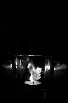 Igniting a Tea Light Wick Foto stock