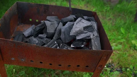Ignition of charcoal in the grill. Stock Footage 138509328