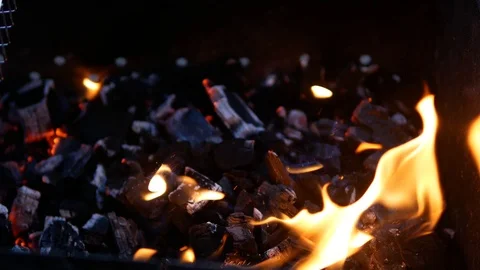 Ignition of coals in the open air Video stock 90367258