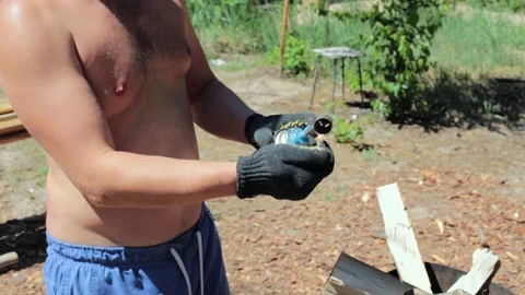 Ignition of firewood in the brazier. Stock-Footage 90343653