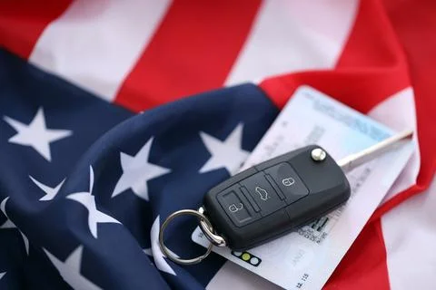 Ignition keys with remote control buttons and driver license card on United Stock Photos