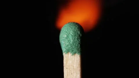 Ignition of a match on a black background Stock Footage 204725254