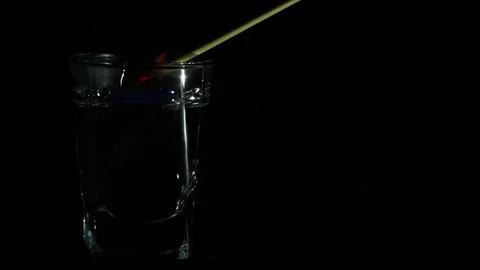 Ignition of the sambuca with a burning stick. Stock Footage 84143241