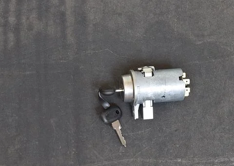 Ignition switch on a black background. Foto stock