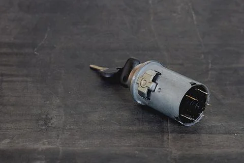Ignition switch on a black background. Stock Photos