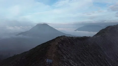 Ijen, Java, Indonesia - May 22, 2025 Aerial view of Ijen volcano ridge at su 스톡 동영상 345740243
