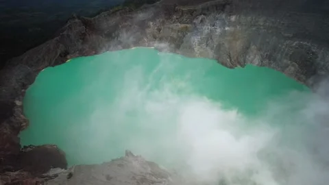 Ijen volcano crater Java bromo indonesia acidic blue lake hiking mountain drone Video stock 230274438