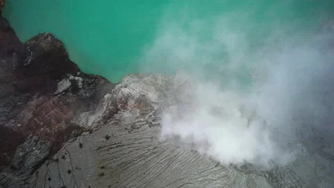 Ijen volcano crater Java bromo indonesia acidic blue lake hiking mountain drone Stock Footage 230274516