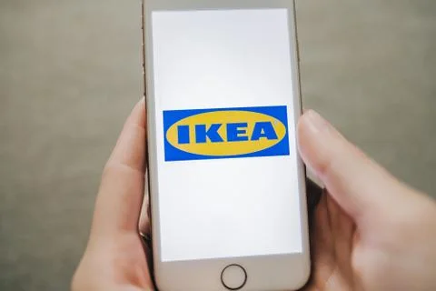 IKEA logo on the smartphone screen. Stock Photos