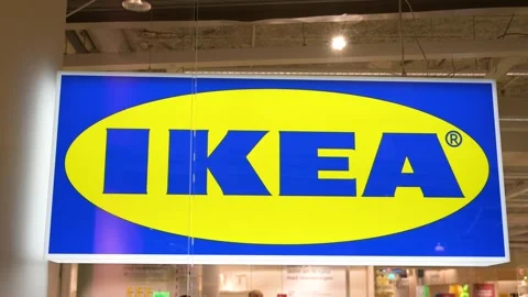 IKEA logo on store exterior. IKEA store with iconic blue and yellow logo. Stock Footage 338327375