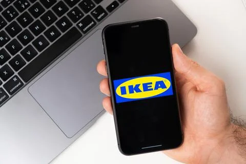 Ikea mobile application on the smartphone screen. A mobile phone in a man hand Foto stock