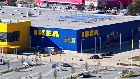 IKEA retail building facade with solar panels on the flat roof in aerial view Stock Footage 337791272